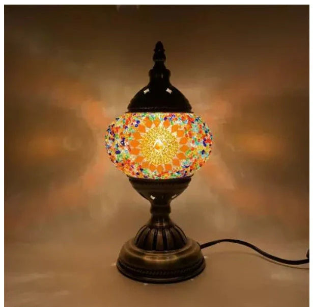 Glass table lamp with 150mm diameter shade and 330cm cord on wooden surface