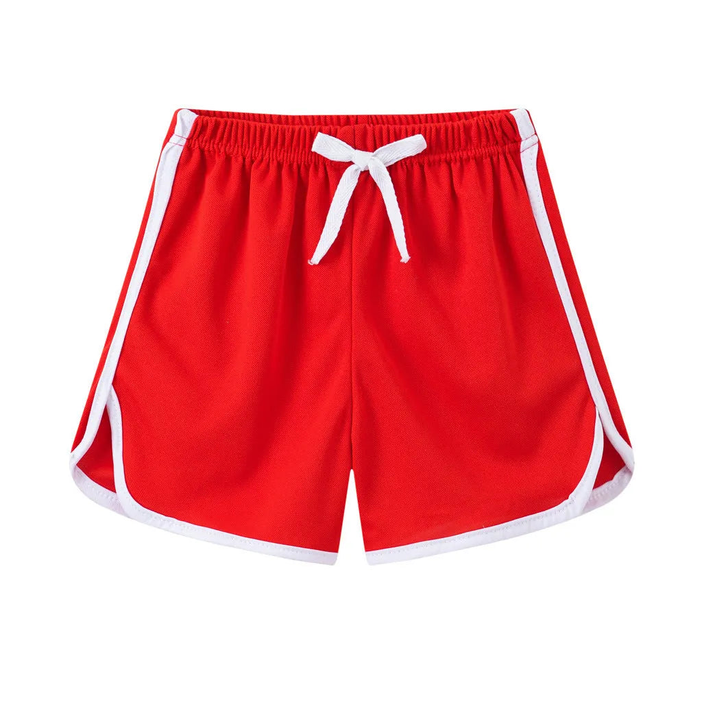 Children's polyester beach shorts in multiple colours and patterns, including leopard print and stripes, shown on size chart.