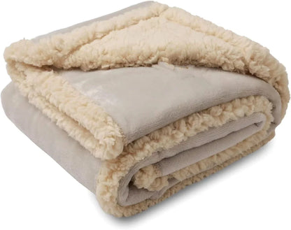Cozy pet blanket made from soft flannel, wool, and sherpa in various colors and sizes