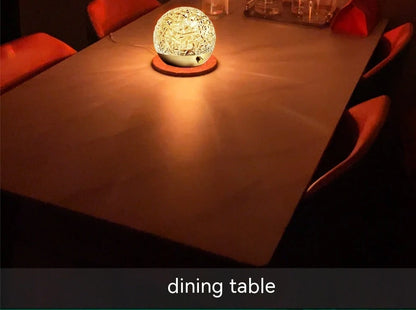 Spherical water ripple projector night light with touch controls creating colourful aurora patterns on wall