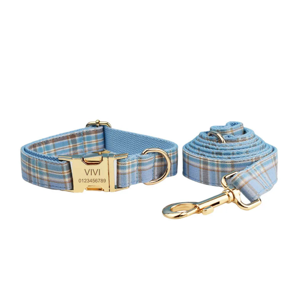 Sky blue grid pattern fabric dog collar, leash, vest, and bow set on a white background.