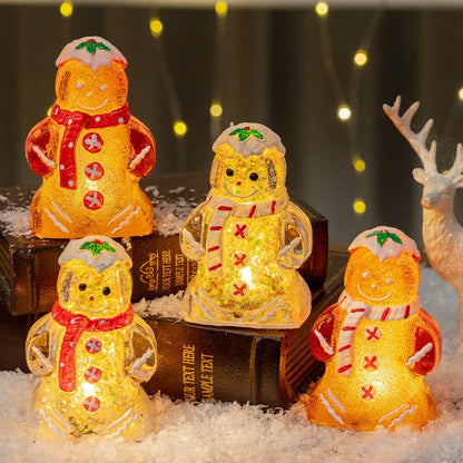 Glowing gingerbread man Christmas ornament measuring 6.5cm wide with LED lights and red scarf