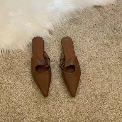 Women's soft leather slippers with semi-toe box in black, khaki, cream-white, and dark brown colours on a rubber sole.