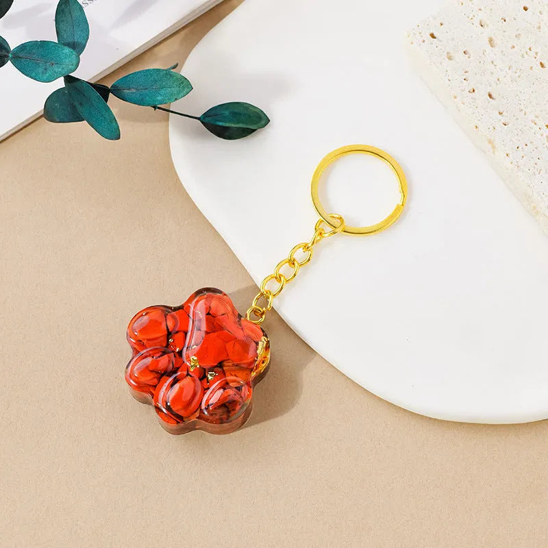 Natural crystal cat's paw keychain pendant showing gemstone options with integrated attachment loop