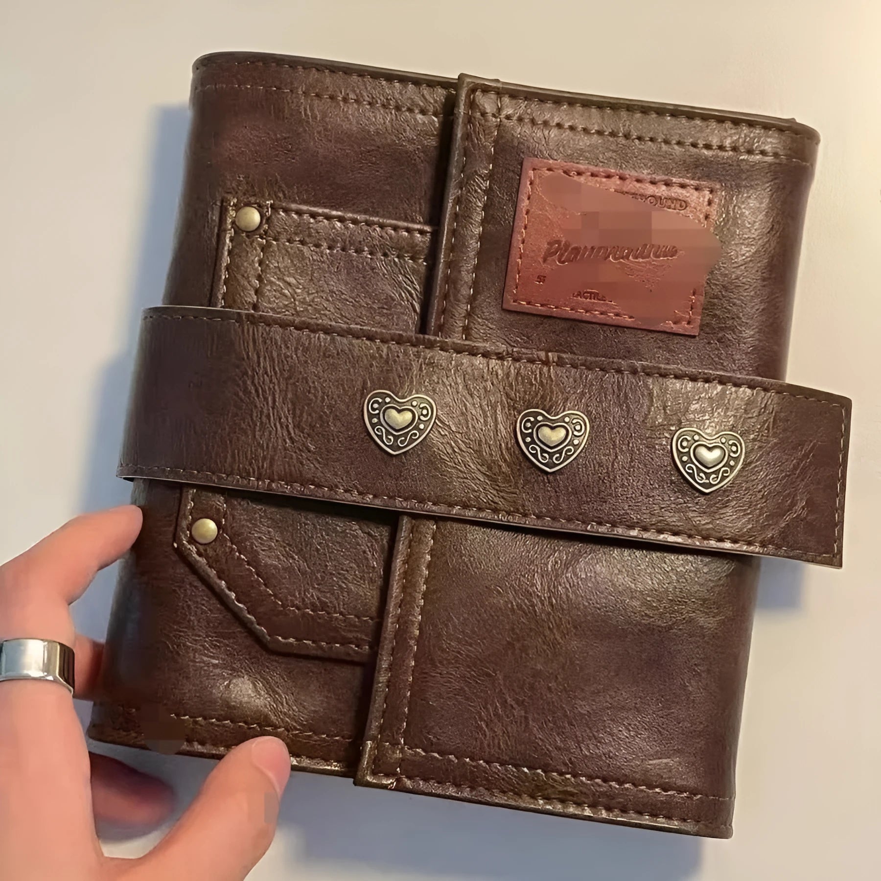 Brown A7 retro leather buckle notebook with loose-leaf binding on PU cover