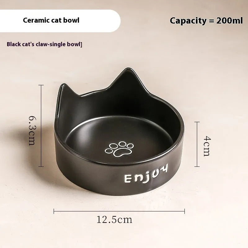 Porcelain cat bowl with anti-tumble wooden frame in pink with a cat paw design