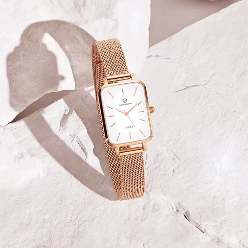 Women's waterproof quartz watch with rose gold alloy case and woven steel strap on wrist
