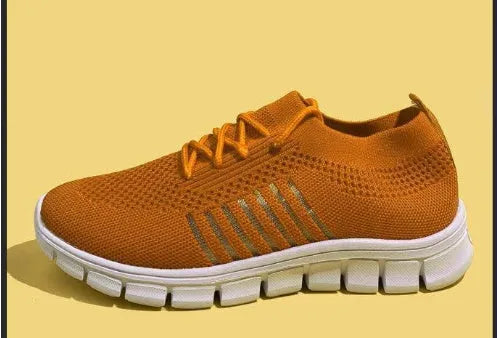 Women's lace-up platform sneaker in multiple colours with a low-top profile and rubber sole.