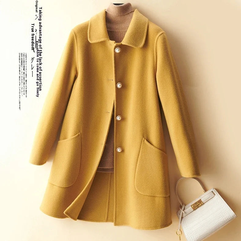 Women's black wool mid-length coat with doll collar and pearl buckle, showing double-faced fabric and 65cm length.