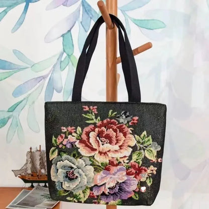 Colourful embroidered canvas shoulder bag with gold wire handles shown in small, medium, and large sizes.