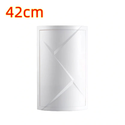 White triangle corner shelf with three tiers mounted in bathroom corner holding toiletries