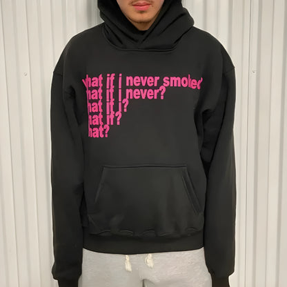 Black hooded pullover sweater with a large letter print on the front, shown on a model.