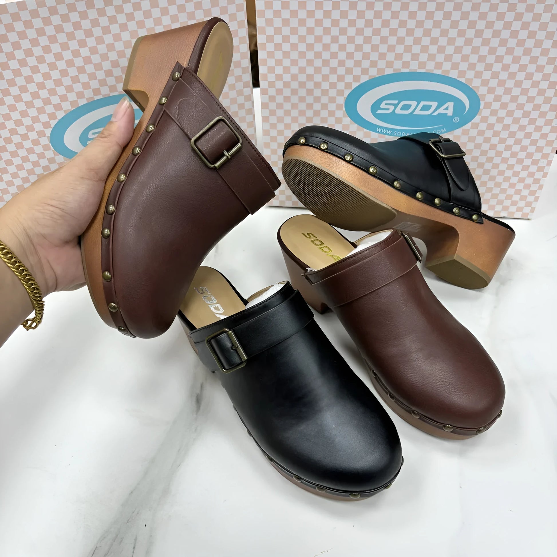Women's black retro chunky heel slippers with closed toe, rivet details, and a rubber sole.