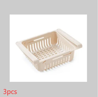 Plastic telescopic refrigerator storage basket in apricot colour, showing multiple compartments for organisation.