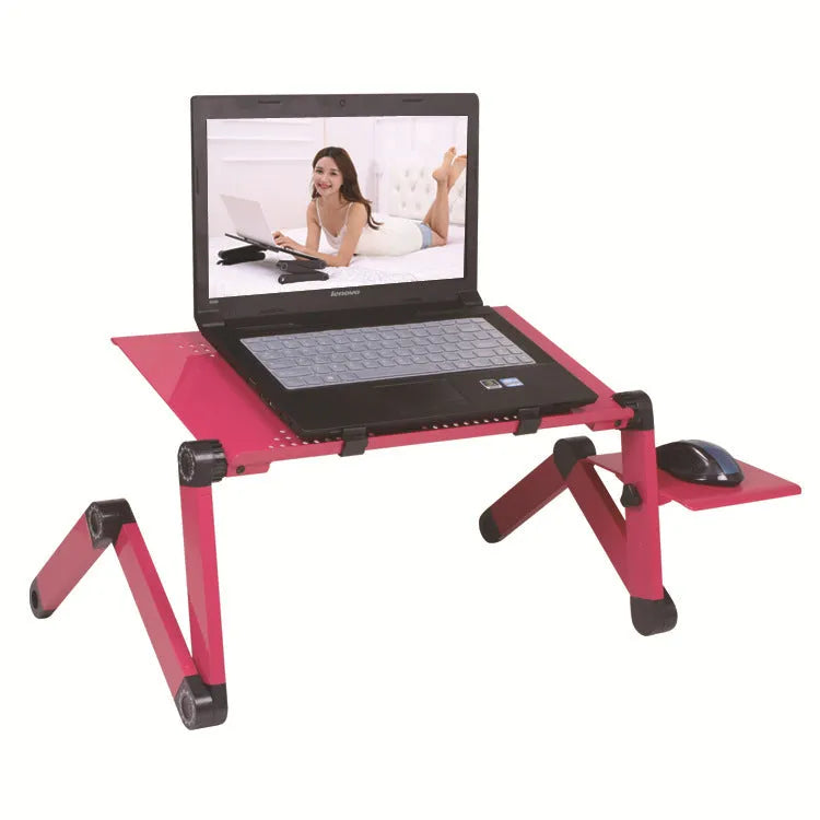 Red folding metal computer desk with cooling fans and mouse board on bed