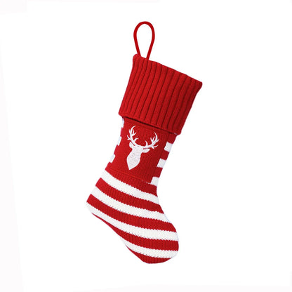 Knitted Christmas cat and dog socks in a gift bag, one pair, with red dog's paw, snowflake, green tree, or red elk patterns.