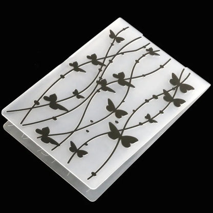 Set of ten plastic cake decorative moulds showing windmill, star, flower, and butterfly patterns.