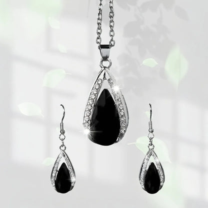 Black red teardrop glass pendant necklace and earrings suite with water droplet design elements on alloy jewellery