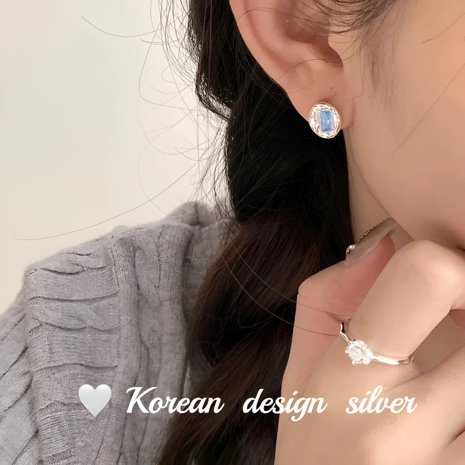 Women's S925 sterling silver earrings with oval blue diamond heart-wrapped design