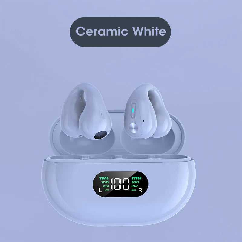 Bone conduction Bluetooth headset clip in black resting on ear with charging cable