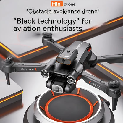 Black P12 quadcopter drone with folded arms next to its remote control and HD camera.