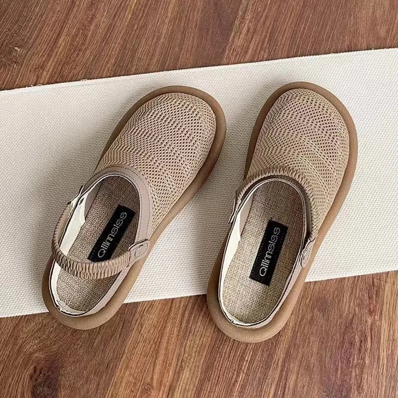 Women's beige linen slip-on shoes with mesh lining and a soft rubber sole.