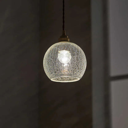 Compact spherical brass and glass ball chandelier with copper finish and clear glass shade, shown in diamond colour.