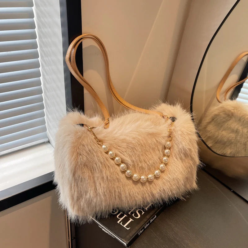 Stylish women's pearl chain crossbody bag in various colors for autumn and winter fashion