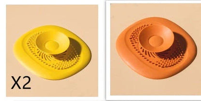 TPR vortex design sink drain cover in twilight orange, quiet blue, mango yellow, and gentian green