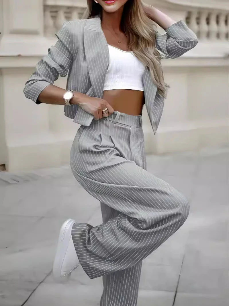 Stylish striped suit set with cropped top and straight-leg pants in a variety of classic colors