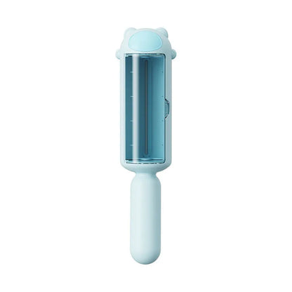 Blue pet hair remover tool with self-cleaning base for removing dog and cat fur from furniture and car seats