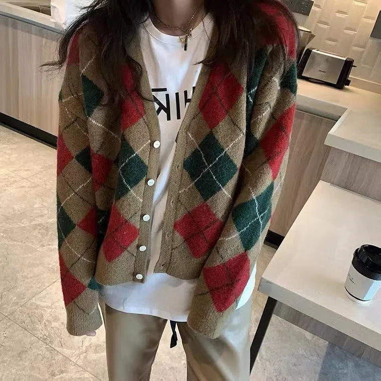 Light khaki knitted acrylic cardigan with regular sleeves on a hanger, free size.