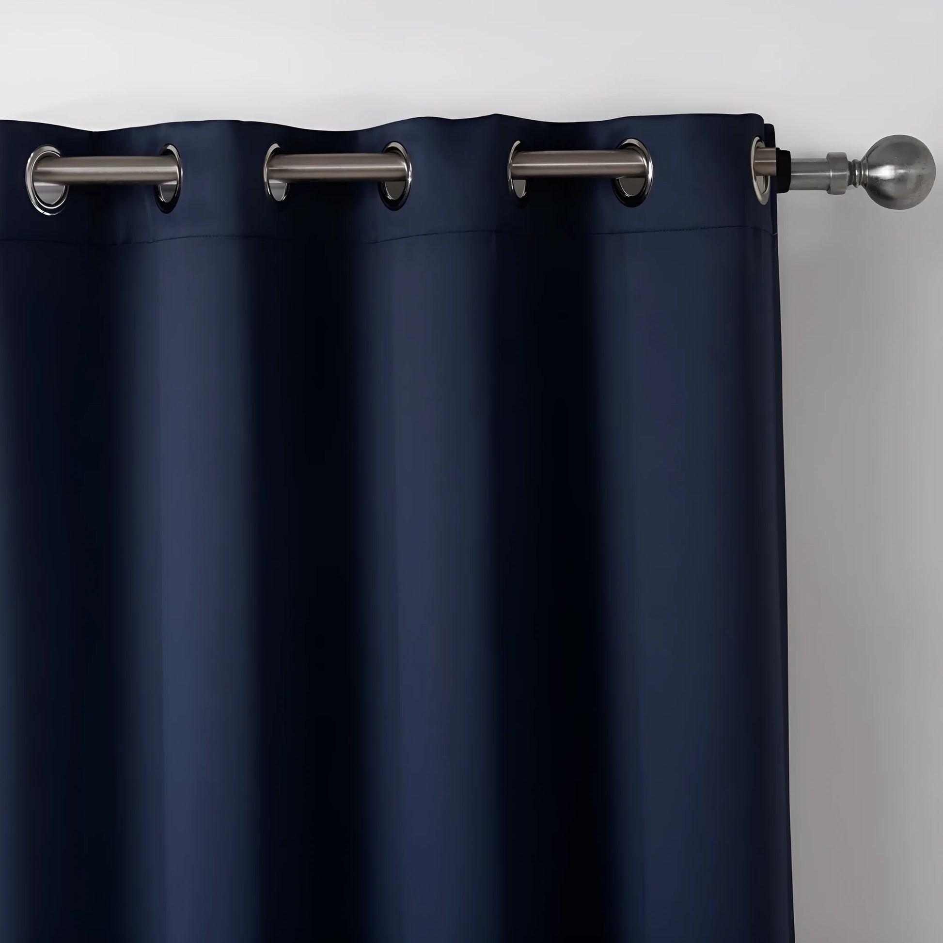 Dark navy blue blackout bedroom curtains hanging with modern simple style