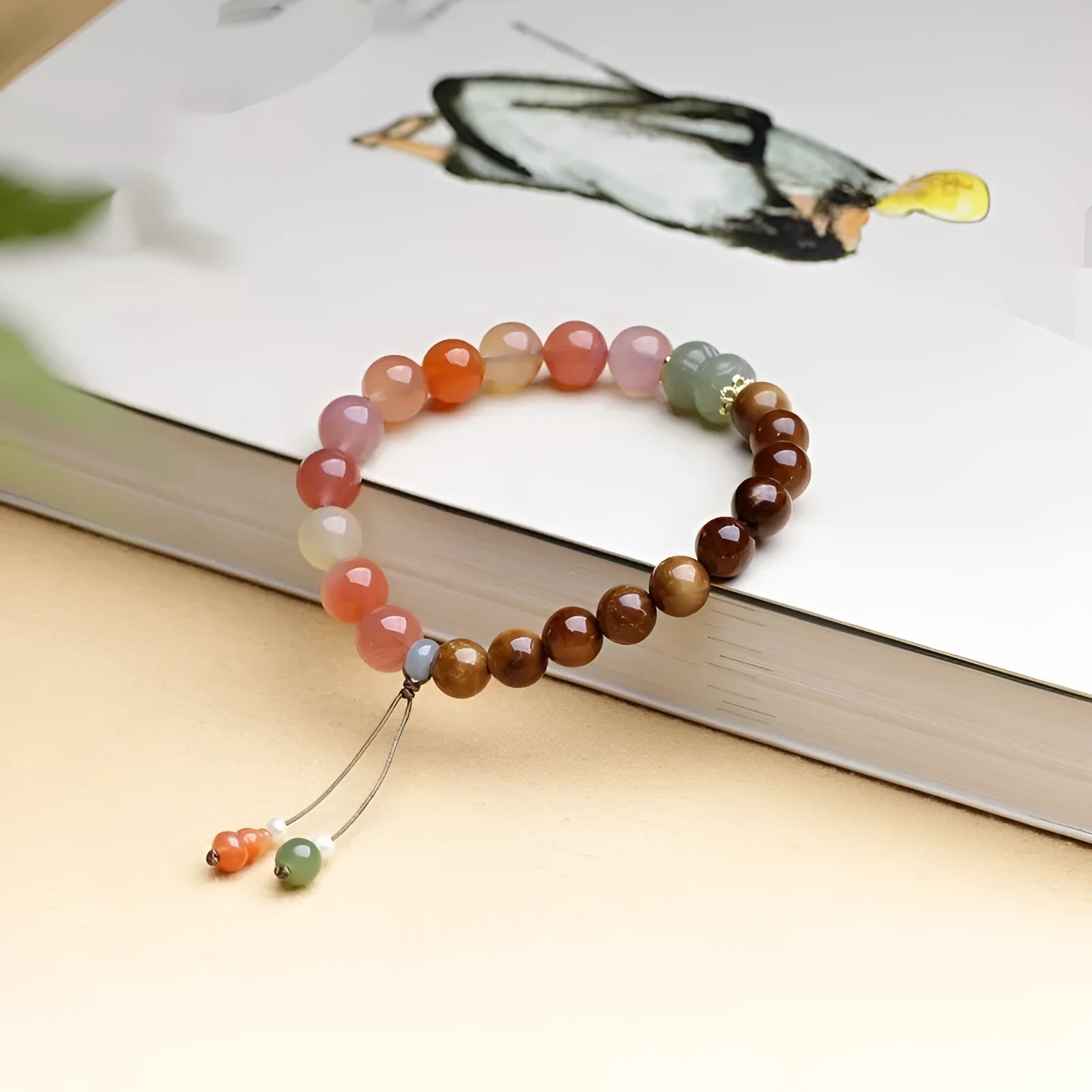 8mm Hetian jade agate bracelet showing diamond-shaped persimmon design elements on natural stone