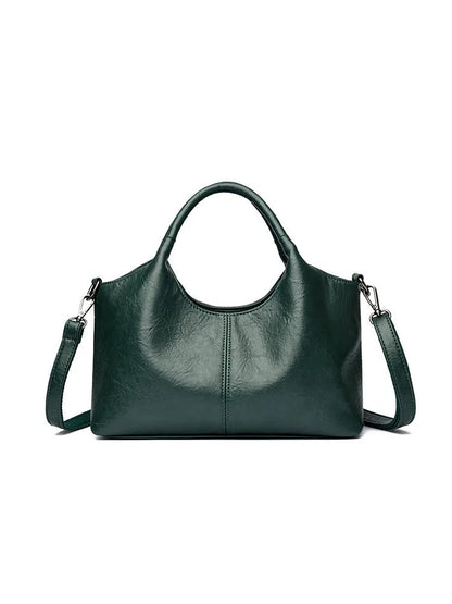 Soft genuine leather women's crossbody bag in beige with large capacity and adjustable strap.