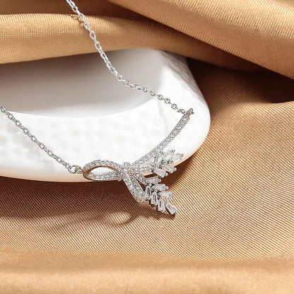 Women's wheat tassel necklace with leaf-shaped pendant and O-shaped chain in silver and gold