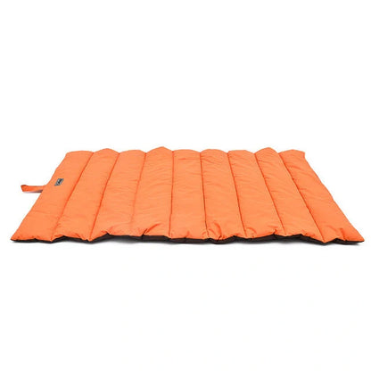 Waterproof and bite-resistant pet mat in brilliant blue, green, light blue, and orange