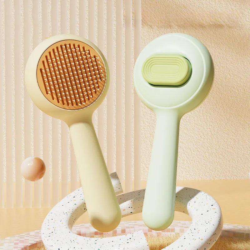 Cat grooming brush with stainless steel teeth and non-slip handle in green or yellow colour options