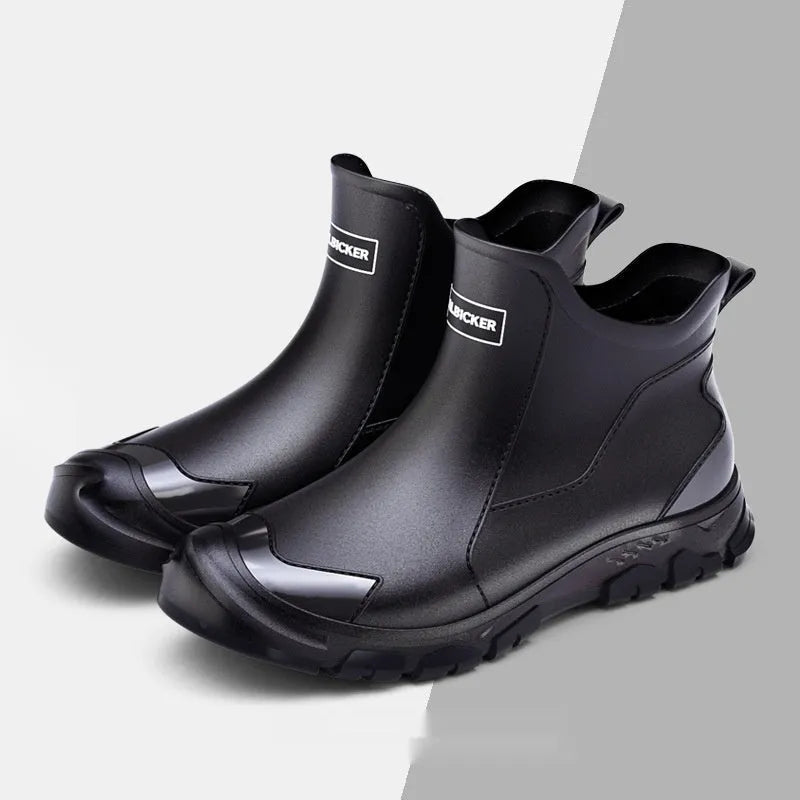 Low-cut solid colour PVC rain boot with round toe and plastic sole.