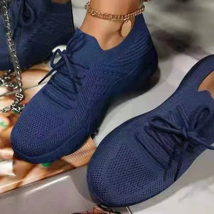 Women's solid colour sneakers with a thick sole, shown in multiple colour options.
