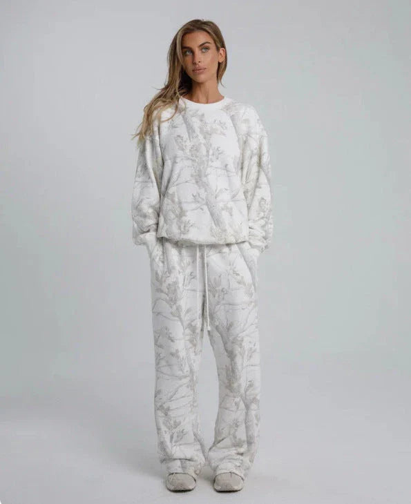 Camouflage and maple leaf print two-piece set for women featuring a hoodie and sweatpants in a variety of sizes