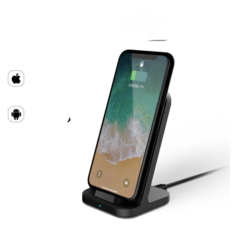 Dark grey vertical wireless charging stand for Apple iPhone on a desk.