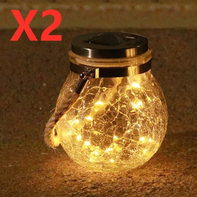 Spherical glass solar LED garden lamp with waterproof design and warm white light