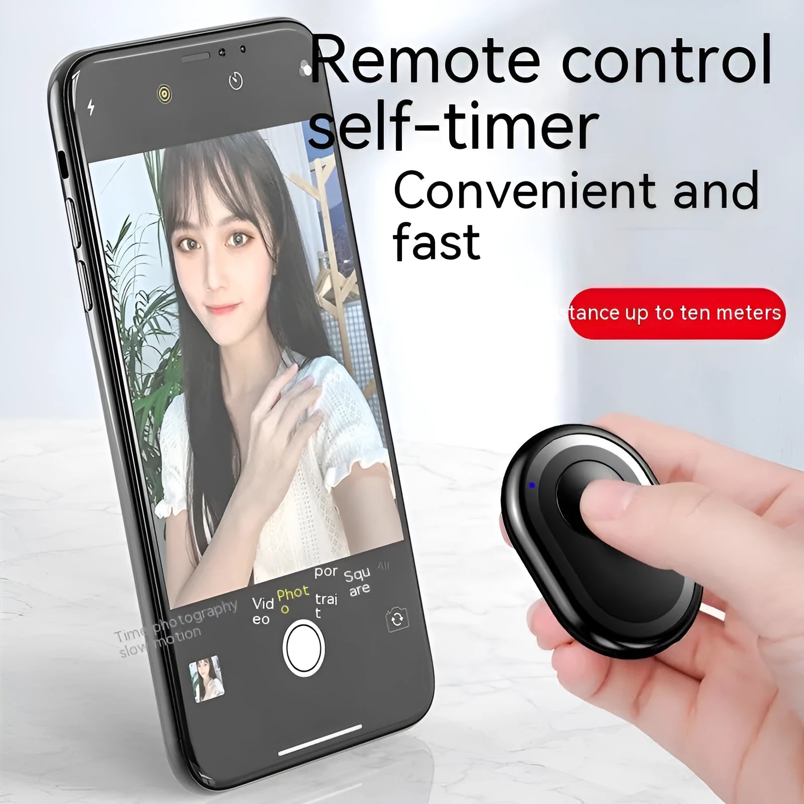 Small black wireless Bluetooth remote control for smartphone camera with self-timer function.