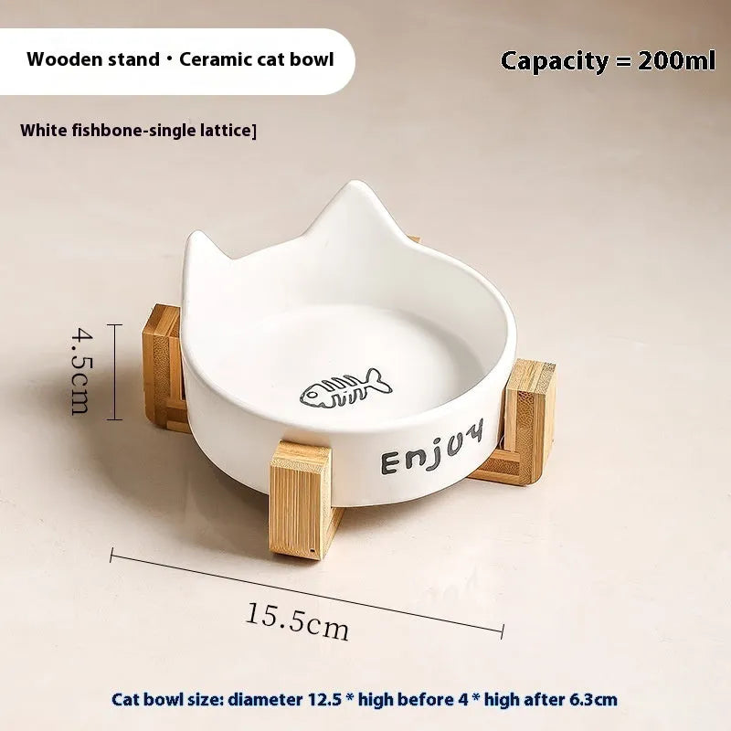 Porcelain cat bowl with anti-tumble wooden frame in pink with a cat paw design