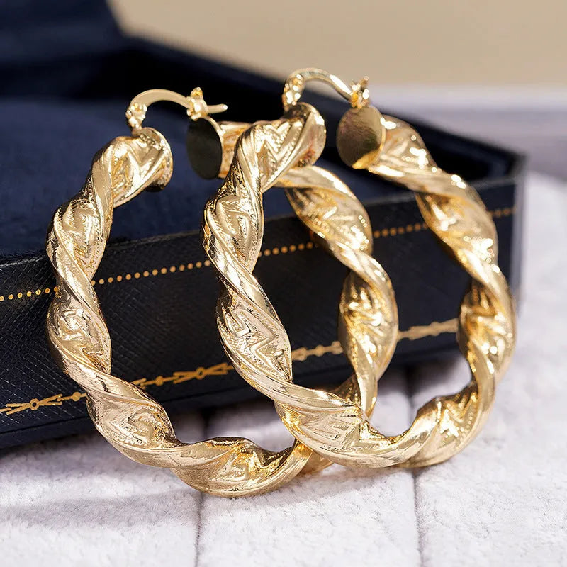 Geometric ear clip design drop-shaped female earrings with electroplated copper construction and European-American styling, available in E4409, E4410, E4412, E4424, E4427, E4438, E4443 colour variants featuring ring and line popular elements.