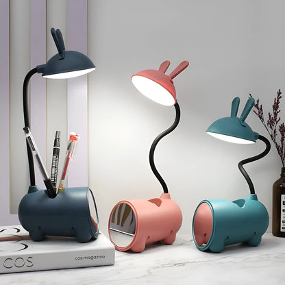 Modern green plastic USB table lamp with a long built-in pen holder on a wooden desk.