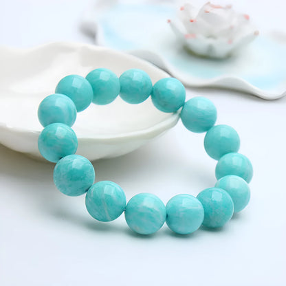 Natural teal blue amazonite gemstone bead bracelet on a white background, showing stretch elastic cord.