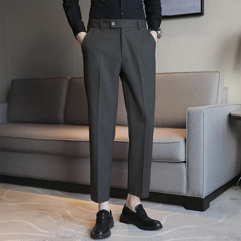 Straight-leg brown corduroy trousers with elastic waistband and slim fit design