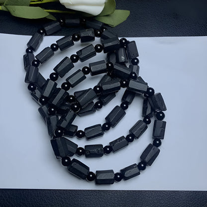 Natural black tourmaline rough stone bracelet with stretch cord on wrist